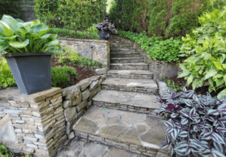 A stone path with steps leading to the top of it.